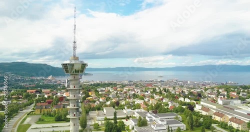 Flying by the Tyholttower and revealing the city of Trondheim photo