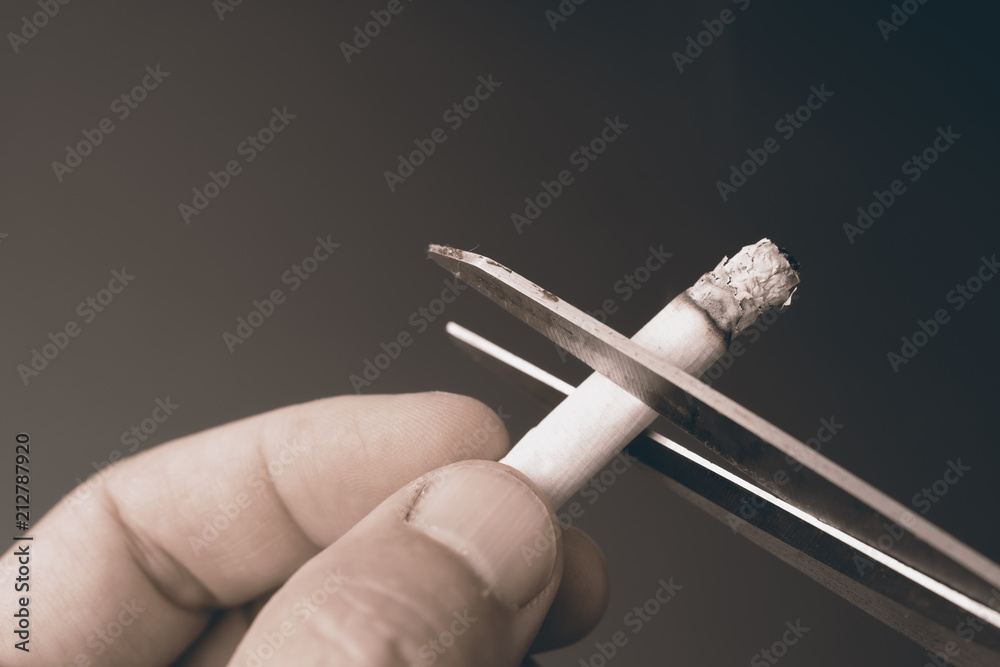 cut cigarette by scissor ,dangeruous to lung,smoking quit concept.