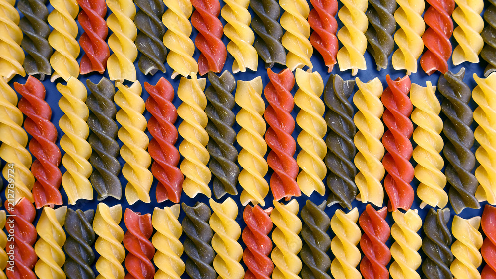 Fototapeta premium colored dry uncooked vermicelli pasta