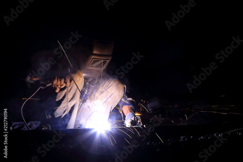 welder worker welding metal construction