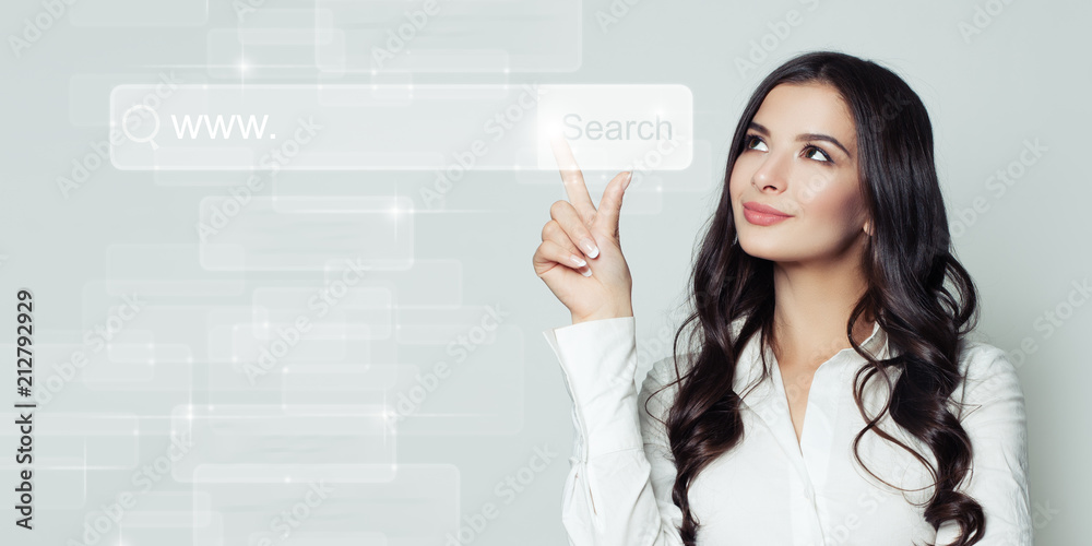 Successful business woman pointing to blank address bar in virtual web browser. Seo, internet marketing or distance learning concept Successful business woman pointing to blank address bar in virtual web browser. Seo, internet marketing or distance learning concept
