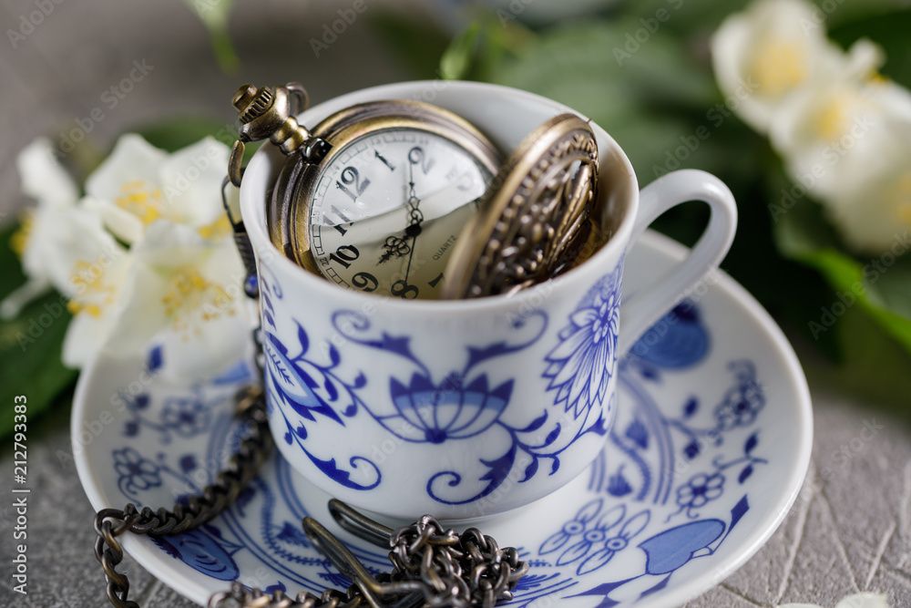 Fototapeta premium A cup of tonic green tea with jasmine and an onion bulb inside.