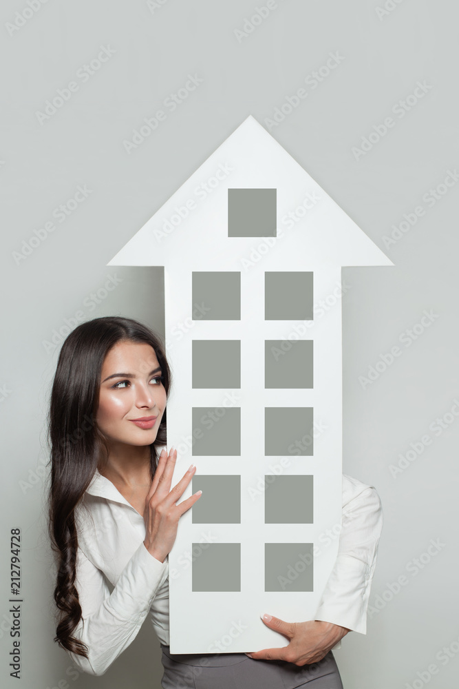 Real estate insurance, protection and property for sale concept. Smiling business woman showing house banner background Real estate insurance, protection and property for sale concept. Smiling business woman showing house banner background