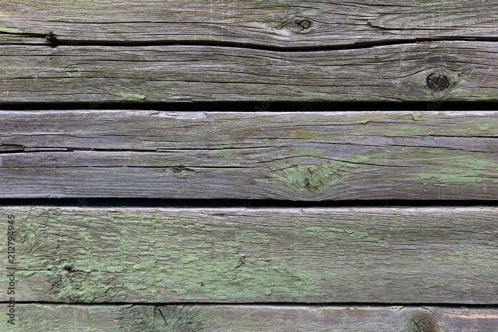 Old wooden background of boards with cracked and peeling paint Old wooden background of boards with cracked and peeling paint