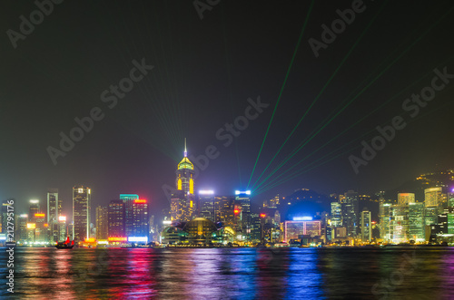 Hong Kong city skyline with light show and reflection, from Kowloon