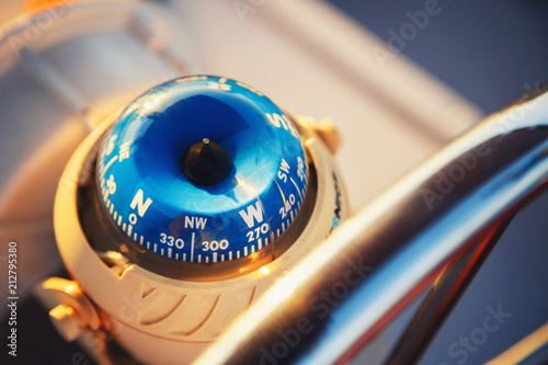 Close up of nautical compass on yacht