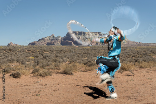 Colorful Navajo native dancer. Desert dancer performing a ritual acrobatic dance