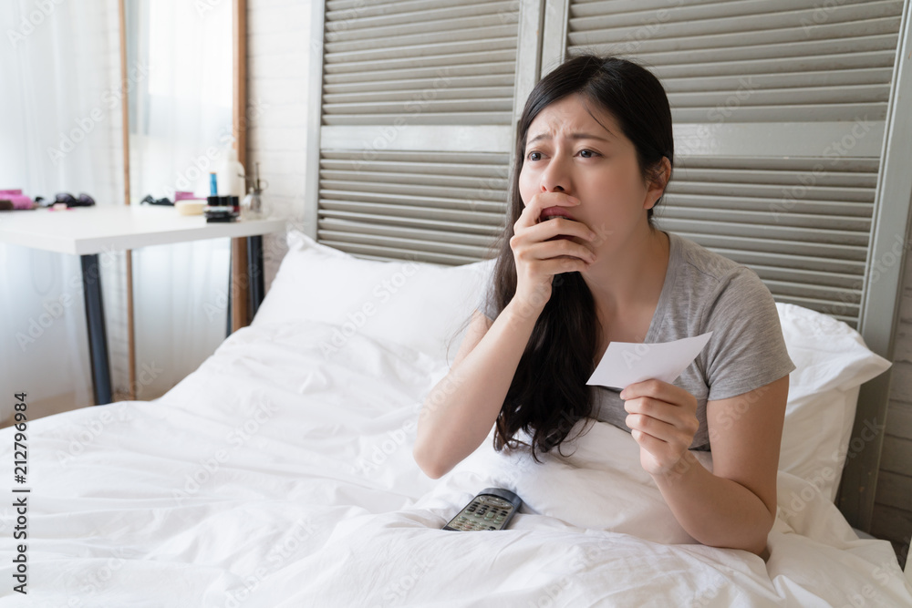 woman covered her mouth to hidden her excitement