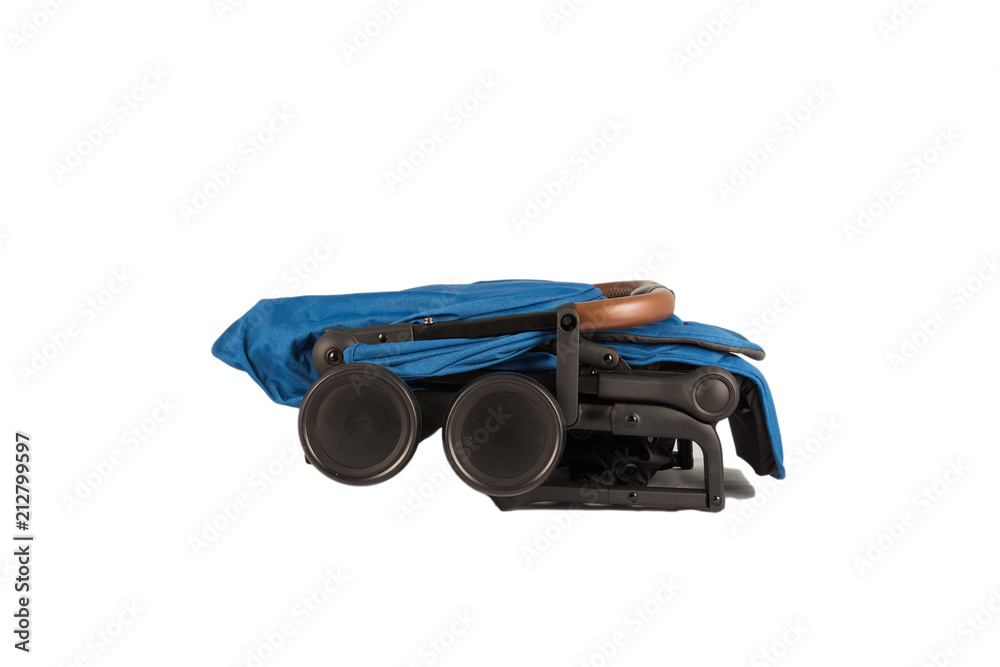 Baby carriage in folded condition for transportation on a trip. Baby carriage in folded condition for transportation on a trip.