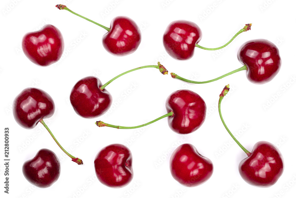Sweet red cherries isolated on white background. Top view. Flat lay pattern Sweet red cherries isolated on white background. Top view. Flat lay pattern