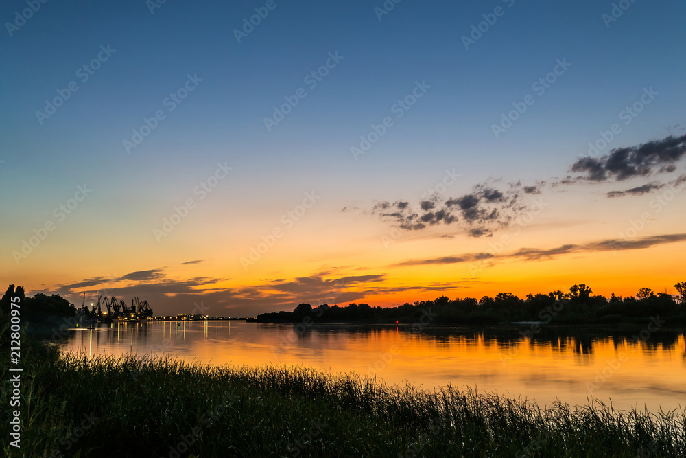 wonderful misty evening. majestic sunset over the river. picturesque dramatic scene. creative image