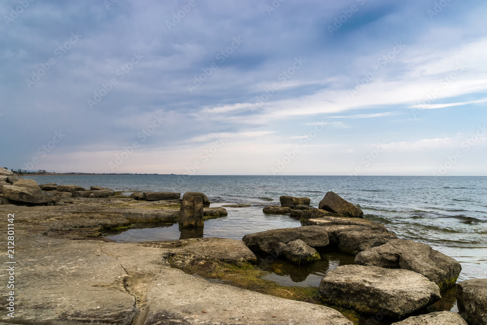 Quite a picturesque view of the rocky coastline of the Black Sea by cloudy day Quite a picturesque view of the rocky coastline of the Black Sea by cloudy day