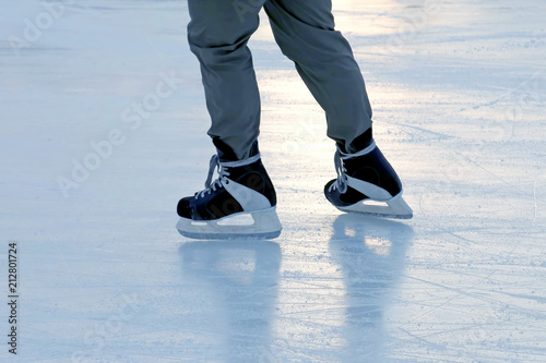 feet skating person at the rink.
