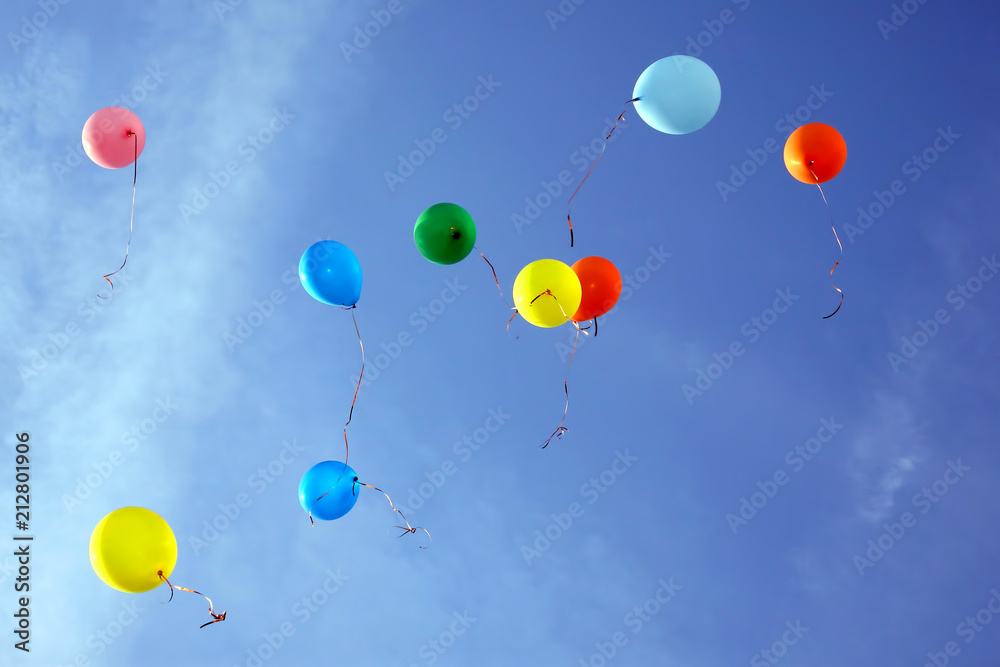 colored balloons flying in the blue sky colored balloons flying in the blue sky