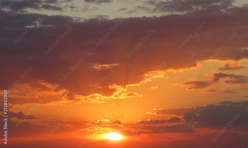 Beautiful fiery orange sunset in the sky, natural background