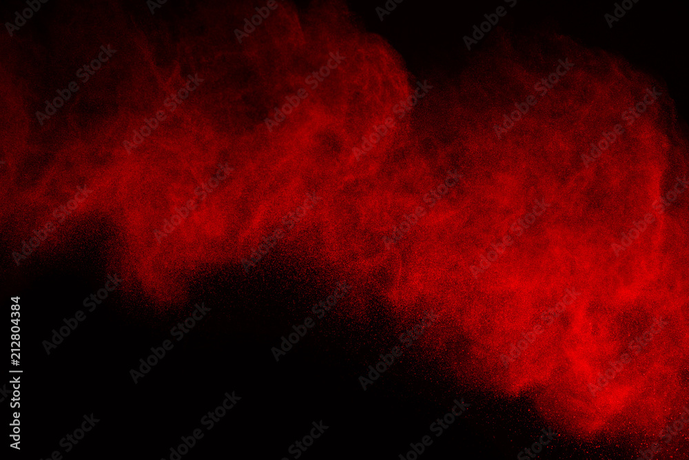 Abstract red powder splatted background,Freeze motion of color powder exploding/throwing color powder,color glitter texture on white background.