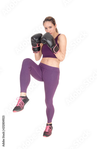 Woman in action boxing in exercise outfits