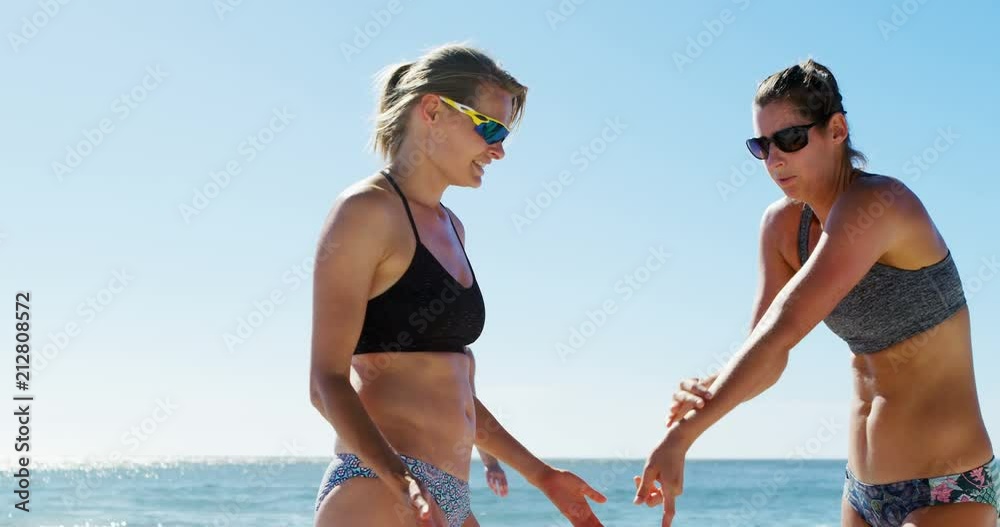 Female volleyball players interacting with each other 4k Female volleyball players interacting with each other 4k