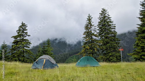 Two tents in a camping in the mountains