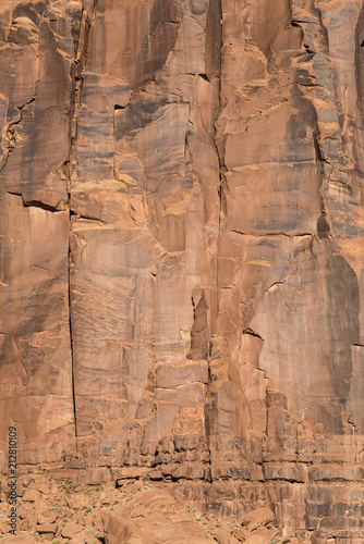 Huge stone wall This desert wall is part of the Monument Valley formations in Utah, USA