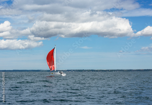 Red sails in the sea, sailing boat 