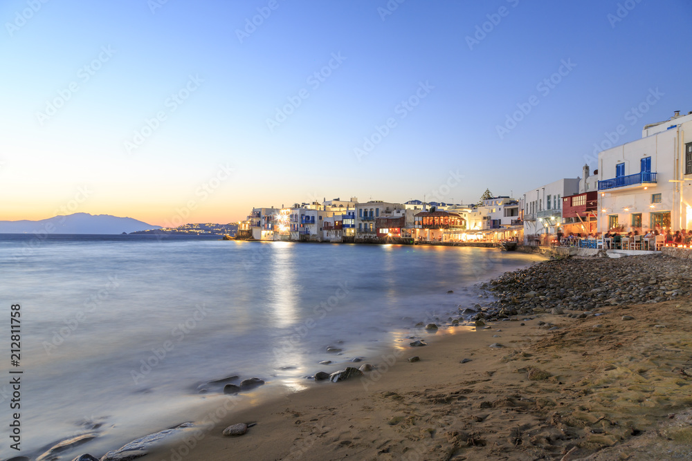 Little venice from beach in old town part of Mykonos, Greece during sunset