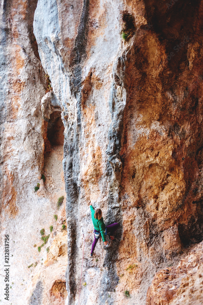 Fototapeta premium A rock climber on a rock.