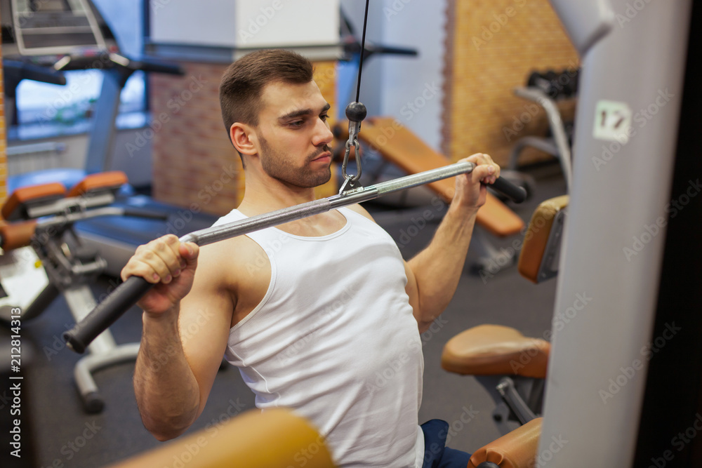 man with weight training in gym equipment sport club man with weight training in gym equipment sport club