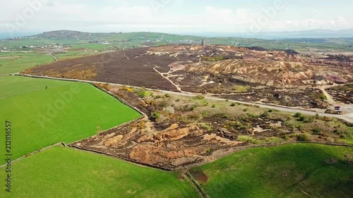 The colourful remains of the former copper mine Parys Mountain near Amlwch on the Isle of Anglesey, Wales, UK photo