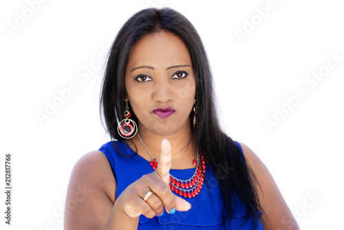 Angry Indian woman, strict face portrait with pointing finger on white background photo