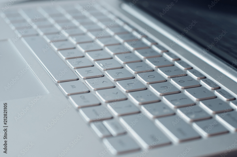 Close-up computer keyboard with touchpad. Laptop buttons