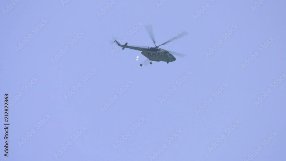 Skydivers jumping out of a military helicopter Skydivers jumping out of a military helicopter
