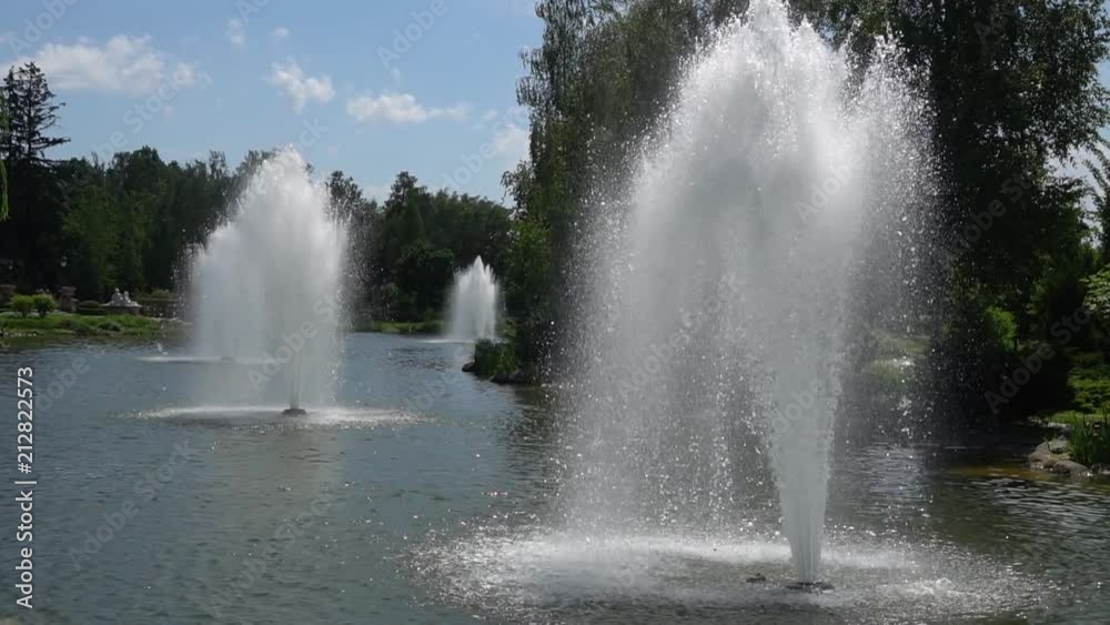Close up image of water streams in fountain abstract background.