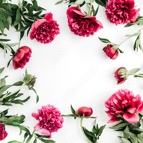 Mock up of pink peony flowers with space for text. Flat lay, top view border frame.