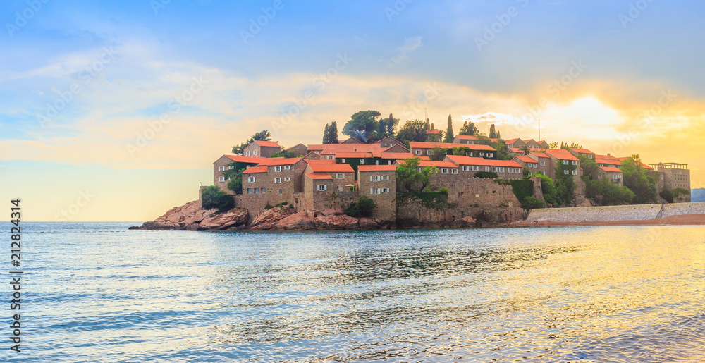 Awesome sunset, famous island Sveti Stefan in Adriatic sea at Montenegro, gorgeous summer seascape