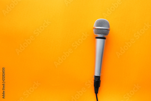 Microphone on yellow background