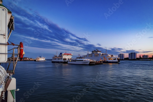 Portsmouth Harbour captured at twilight with ferry boats moored up for the day photo