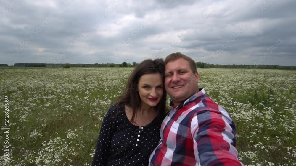 Romantic Happy Couple In Love Taking Photos On Phone In Nature. Romantic Happy Couple In Love Taking Photos On Phone In Nature.