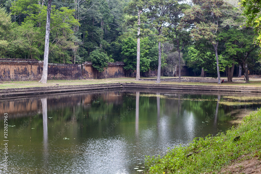 Pond in Angkor Thom park, Angkor Wat complex, Cambodia. Green park lake of Angkor Thom internal yard. Pond in Angkor Thom park, Angkor Wat complex, Cambodia. Green park lake of Angkor Thom internal yard.