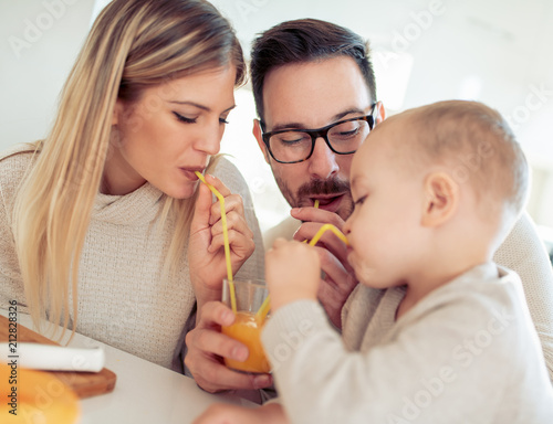 Family drinking orange juice