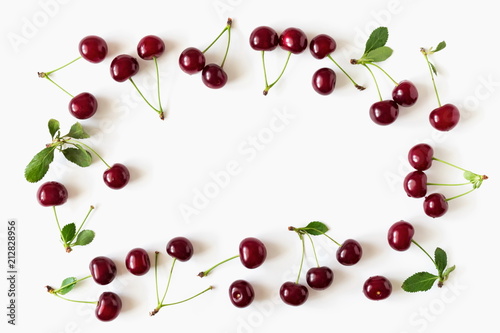 Cherry pattern. Ripe cherry berries and leaves isolated on white background. Berry summer background. Flat lay, top view, copy space 