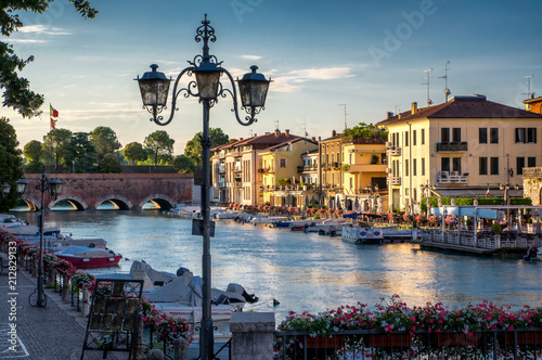 Boats and the bridge in port on Lake Garda, Peschiera del Garda