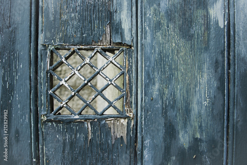 Emerald shabby door Cracked weathered wooden texture photo