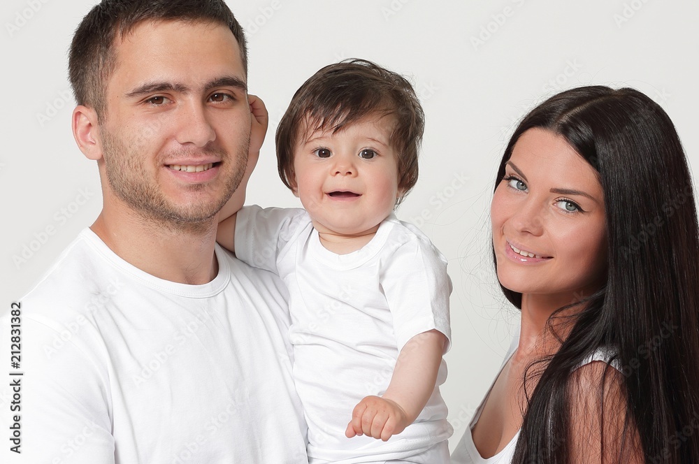 Happy family with newborn baby on a white background. Happy family with newborn baby on a white background.