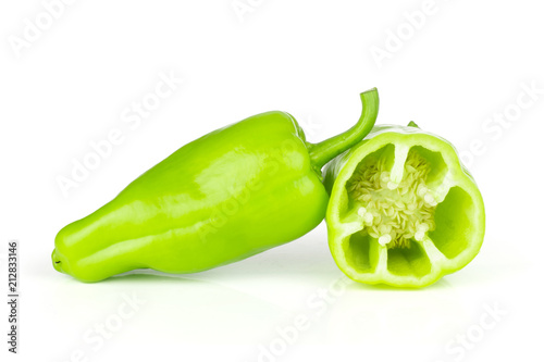 Group of one whole one half of light green bell pepper isolated on white. photo