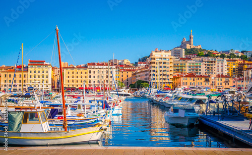 Summer view on basilica of Notre Dame de la Garde and old port in Marseille, France photo