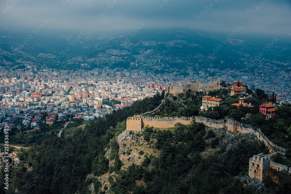 Alanya, Turkey. Wonderful country. At home from a height. Roofs of buildings. Antique Castle. View of the city. Foggy weather