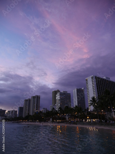 dramatic purple pink sunset sky clouds above waikiki beach hotels hawaii © Anastasia