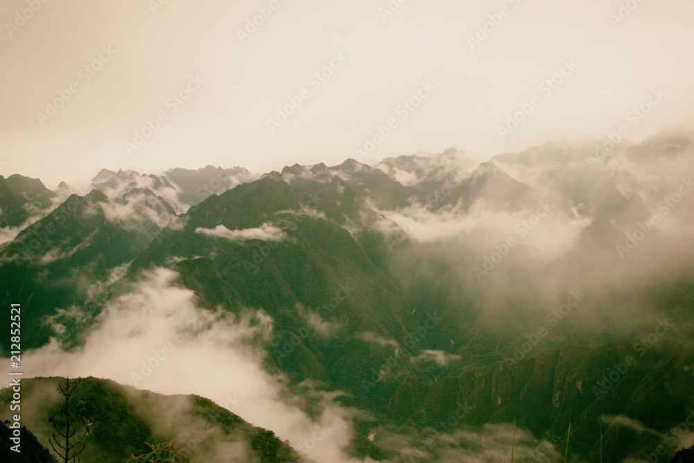 Panoramic inspirational view of the Andes mountains in mist on the Inca Trail. Peru. South America. No people.
