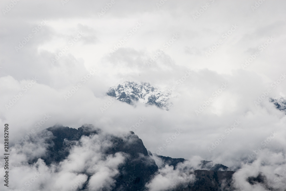 Intense fog and clouds covering the mountains on the Andes viewed from a higher peak on the Inca Trail to Machu Picchu, Peru. Amazing wallpaper.